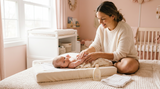 Parent applying baby lotion during a gentle skincare routine