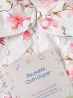 Popees Baby Reusable Cloth Diaper | Adjustable Snap Closure | Floral Print | Newborn (color may vary depending on availability)